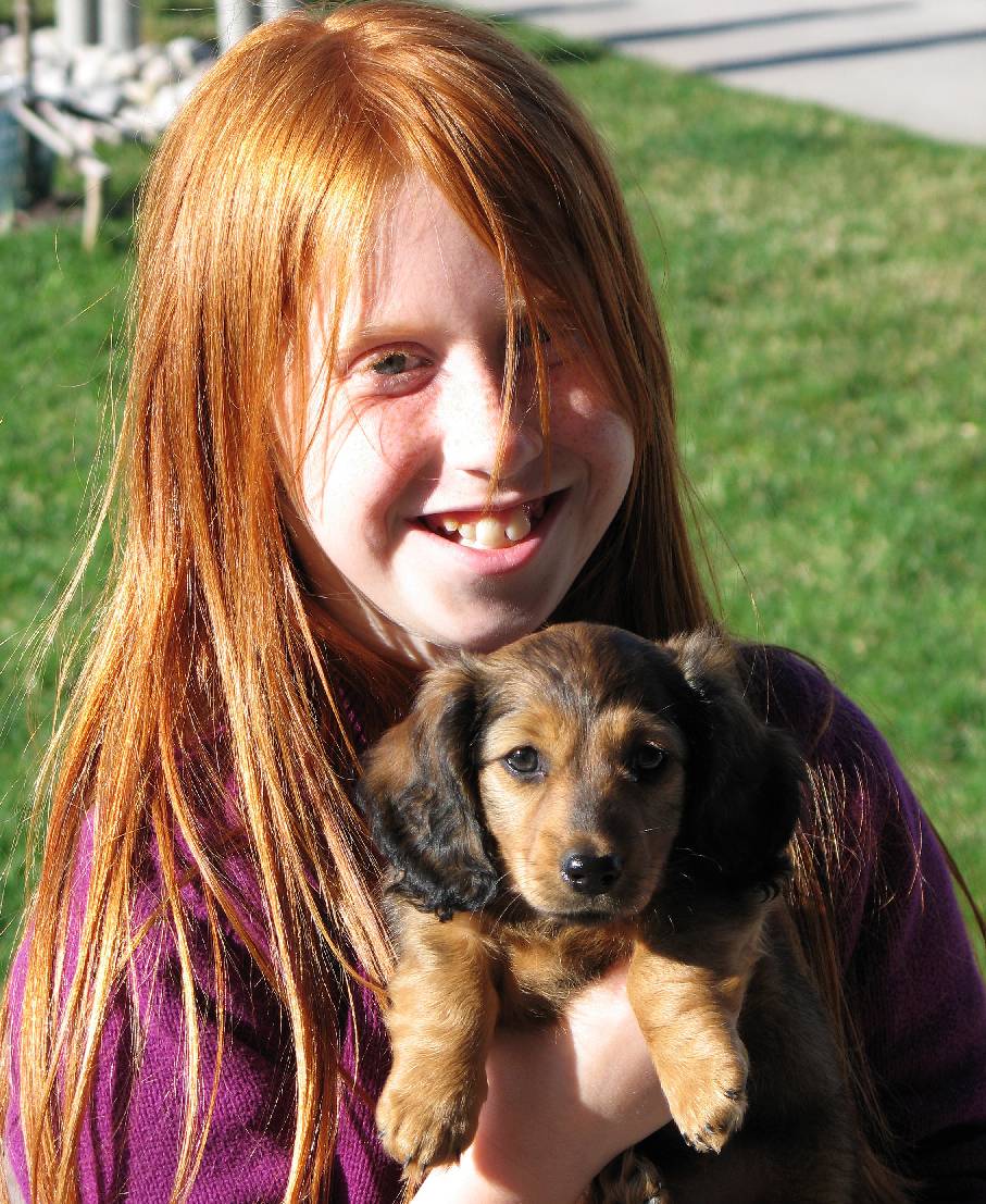 OLIVIA, ONE OF CHUCKY'S TUTORING PUPILS, AND HER NEW PUPPY